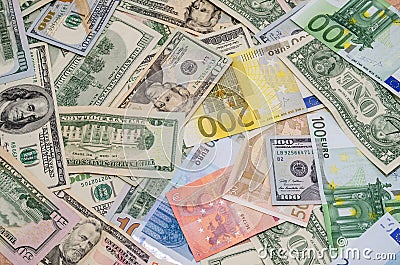 Pile of two leading currencies - US Dollar versus Euro Stock Photo