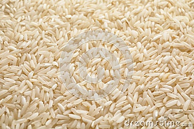 Pile of uncooked rice as background Stock Photo