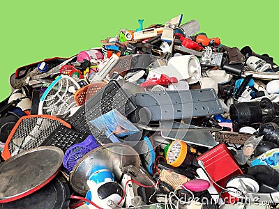 Pile of used Electronic and Housewares Waste Division broken or damage with green background, E-waste for Reuse and Recycle and is Stock Photo