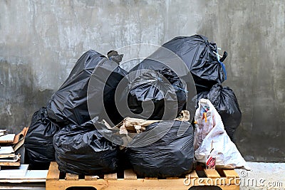 Pile of waste garbage plastic black and trash bag stack waste many Stock Photo