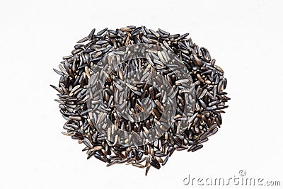 Pile of whole-grain niger seeds on gray Stock Photo