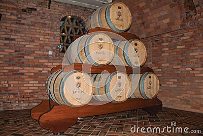 Pile of wood barrels for wine at the Salton Winery Editorial Stock Photo