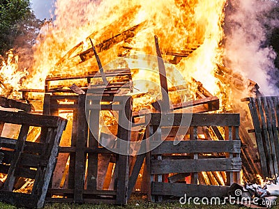 Raging Bonfire. Pile of burning pallets Stock Photo