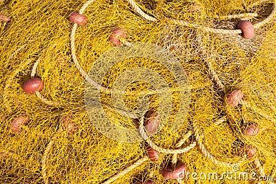 Pile of yellow fishing nets Stock Photo