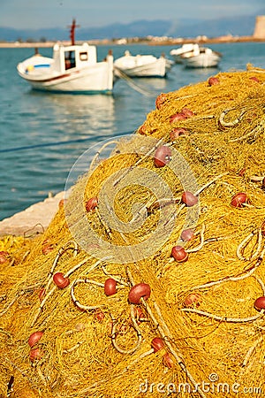 Pile of yellow fishing nets in port Stock Photo