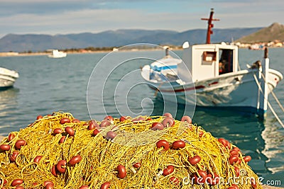 Pile of yellow fishing nets in port Stock Photo