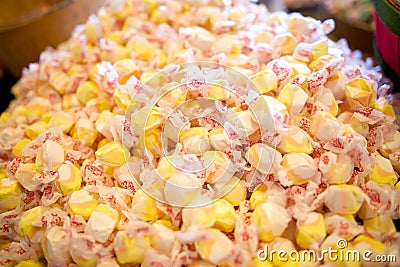 Pile of yellow salt water taffy candy, colors Stock Photo