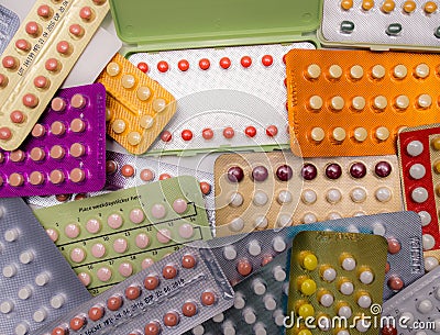 Piles of colorful birth control pills Stock Photo