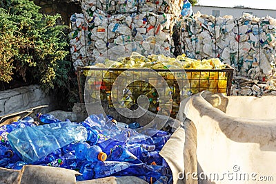 Piles of compressed plastic bottles at the recycle factory Editorial Stock Photo