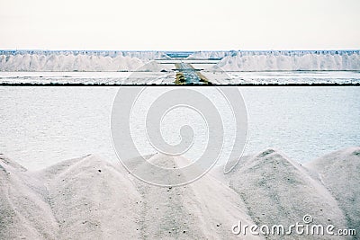 Piles of crystallised salt at a saline refinery Stock Photo