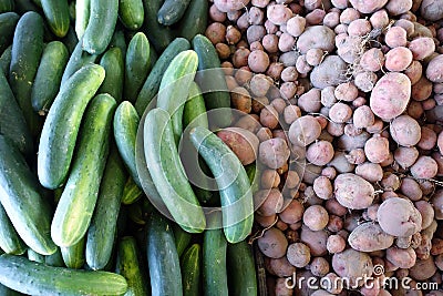Cucumbers and Red Potatoes for Sale at a Farmers Market Stock Photo