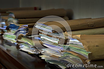Piles of documents enclosed in folders and forgotten on a wardrobe Stock Photo