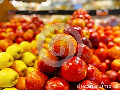 Piles of fresh colorful bright apples retail store Stock Photo
