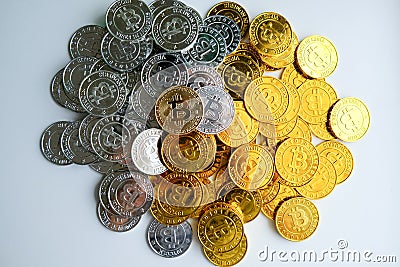 Among piles of golden and silver bitcoin and blockchain nodes all around . Blockchain transfers virtual cryptocurrency concept Stock Photo