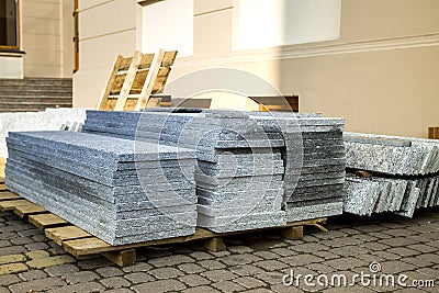 Piles of granite marble slabs. Stone sheets for decorative construction Stock Photo