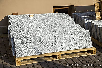 Piles of granite marble slabs. Stone sheets for decorative construction Stock Photo