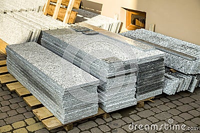 Piles of granite marble slabs. Stone sheets for decorative construction Stock Photo