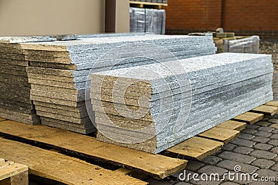 Piles of granite marble slabs. Stone sheets for decorative construction Stock Photo