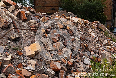 Piles of old red bricks and stones from ruins of old buildings Stock Photo