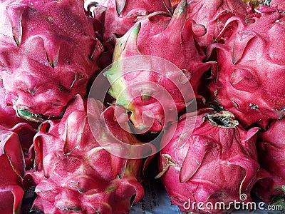 Piles of red dragon fruit at a traditional market in Jakarta Stock Photo