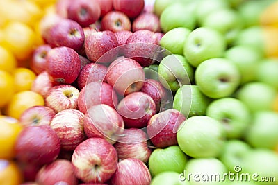Piles of Red and Green Apples with Oranges Stock Photo