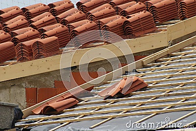 piles of roofing-tiles on a house Stock Photo