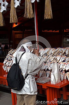 Pilgrim at Fushimi Inari Temple, Kyoto, Japan Editorial Stock Photo