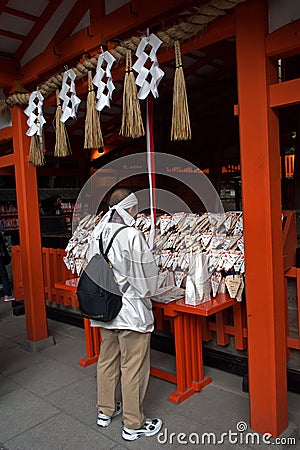 Pilgrim at Fushimi Inari Temple, Kyoto, Japan Editorial Stock Photo