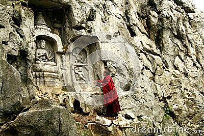 A pilgrim In klippe ancient grotto art Editorial Stock Photo