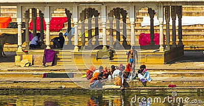 Pilgrims at a Bathing Ghat at Pushkar's Holy Lake Editorial Stock Photo