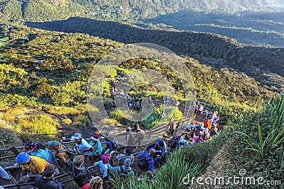 Pilgrims climb the trail to the holy mountain Adams Peak also Sri Pada is the most popular pilgrim place in Sri Lanka Editorial Stock Photo