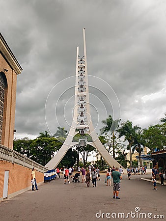 Pilgrims in front of the bell tower of the Basilica of Aparecida, Brazil. Editorial Stock Photo