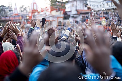 Pilgrims praying during Ganga Aarti at Har Ki Pauri Editorial Stock Photo