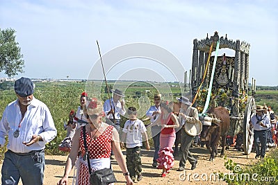 Pilgrims on their way to El Rocio with holy shrine Editorial Stock Photo