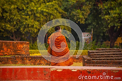 Pilgrims visit the birthplace of Buddha during Buddha Jayanti Young monk prayer, Editorial Stock Photo