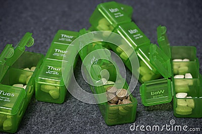 Daily pill box with medical pills Stock Photo