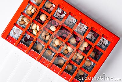 Pill box weekly organizer with pills and vitamins. Copy space for own text. Stock Photo