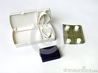 Pill cutter and white tablets Stock Photo