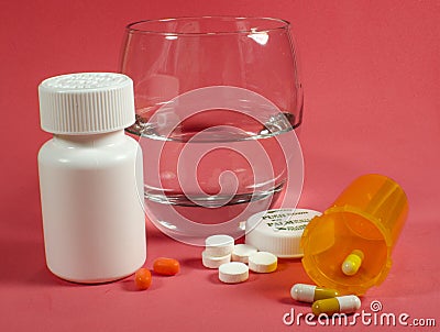 Pill and a glass of water Stock Photo