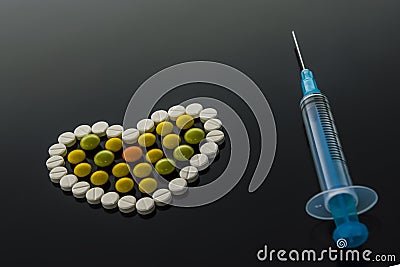 Pill heart and syringe Stock Photo