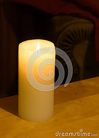 Pillar Candle burning Stock Photo