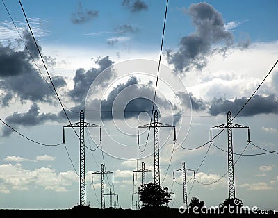 Pillars of line power electricity on background blue sky Stock Photo