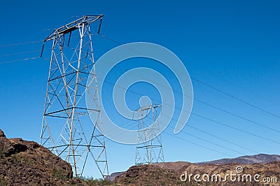 Pillars wire leading on rocky country Stock Photo