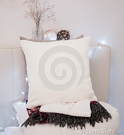 Pillow case Mockup. White pillow on bed in cozy bedroom. Stock Photo