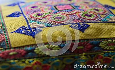 Pillow with oriental decorations and colored drawings background Stock Photo