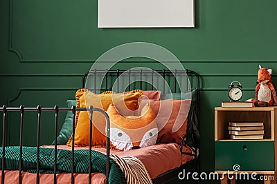 Pillow on single bed in dark green teenager bedroom Stock Photo