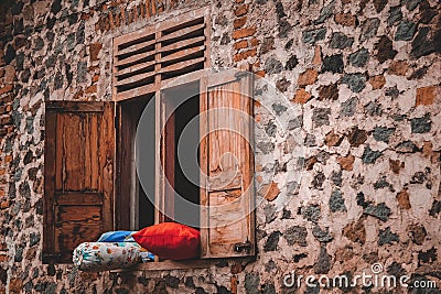 Pillows and bolsters that are drying on the window Stock Photo
