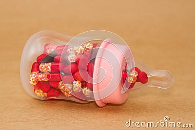 Pills in baby bottle Stock Photo