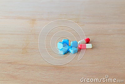 Pills blue and capsule On wooden floor with copy space add text Stock Photo