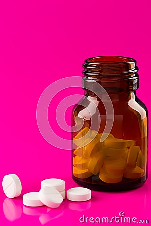 Pills bottle and medicine ampule Stock Photo